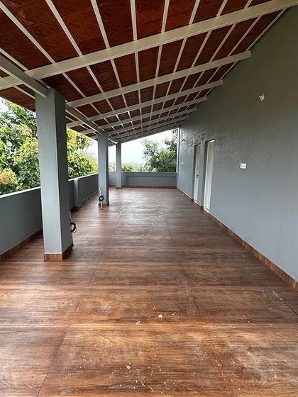 An identical photo of the expansive and airy terrace.