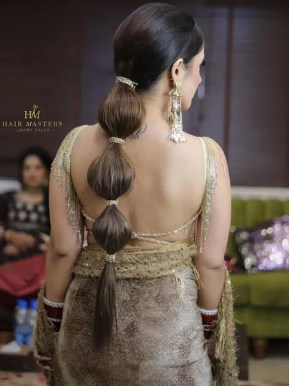 A back view of a chic and modern bubble ponytail, a stylish choice for any festive occasion.