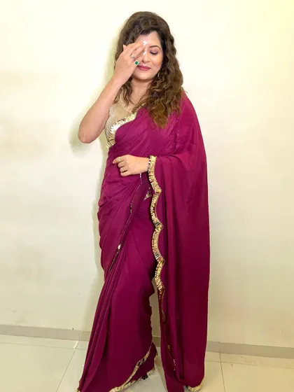 A candid and shy moment captured. The makeup is soft and natural, perfect for a casual and elegant look.