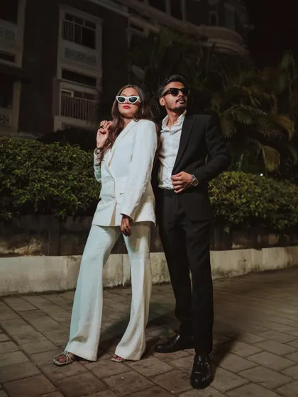 A powerful, stylish pose from Harsh and Shreya's night shoot. The couple stands confidently, showcasing a chic and edgy side to their pre-wedding album.