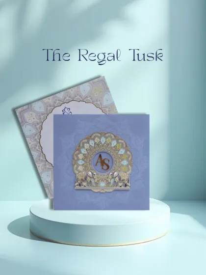 The Regal Tusk. This premium wedding card features a majestic elephant motif within an ornate mandala, symbolizing strength and good fortune for your union.