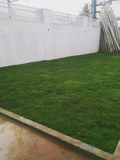 After: The finished lawn at the Yelahanka villa. The result is a vibrant, uniform green space that adds significant beauty and value to the home.