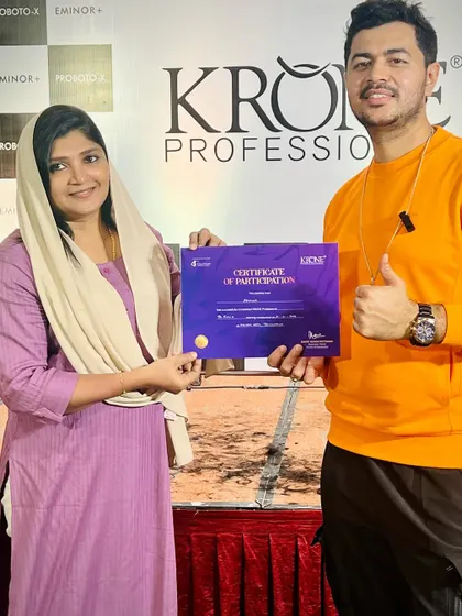 Another happy stylist receiving her certificate after completing my workshop.