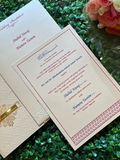 A sophisticated Nikah invitation in cream and gold. The set includes a main insert with elegant English and Arabic text.