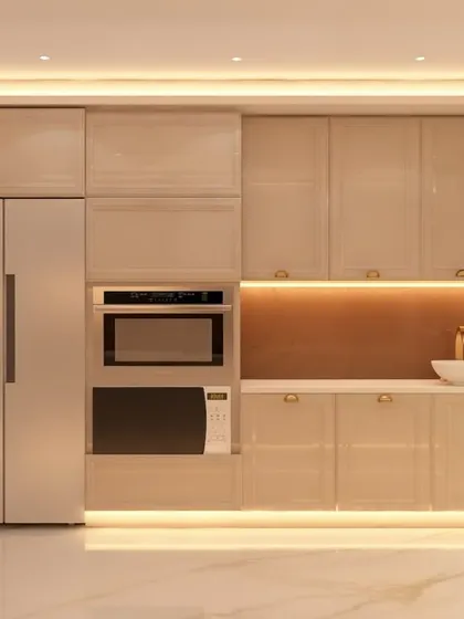 This compact utility kitchen is designed for maximum efficiency, featuring high-gloss beige cabinets and integrated appliances. The warm under-cabinet lighting ensures the workspace is well-lit and functional.