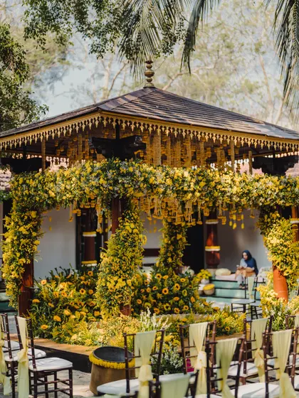 Another angle of the sun-kissed Haldi decor, showing the guest seating arranged to provide a clear view of the ceremony. We consider every aspect of the guest experience in our layouts.