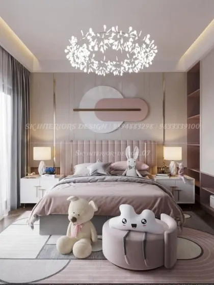 A charming kids' bedroom with a soft pink color palette and playful decor. The design includes a custom headboard, whimsical lighting, and plenty of space for play.