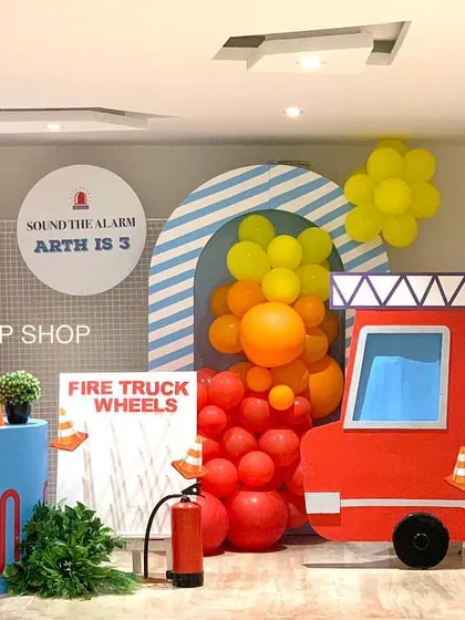 Sound the alarm for this amazing fire truck theme! Our setup includes a large fire truck prop, themed backdrops, and a custom marquee number for the birthday boy.