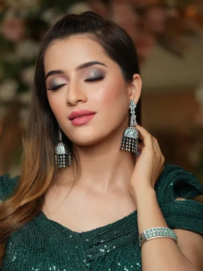 The eyes tell a story. This close-up showcases the detailed eyeshadow work, a key skill for creating memorable and glamorous evening makeup.