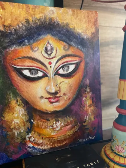 A close up of my Durga Ma painting for the year, done with acrylics. I used a palette knife to create texture and depth, giving her a powerful and modern feel.