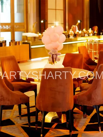 Another example of a teddy bear table centerpiece, this time with a teddy holding a pot of honey.