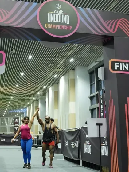 Victory! Celebrating at the finish line after a grueling competition. This is the feeling of accomplishment we chase in every workout.