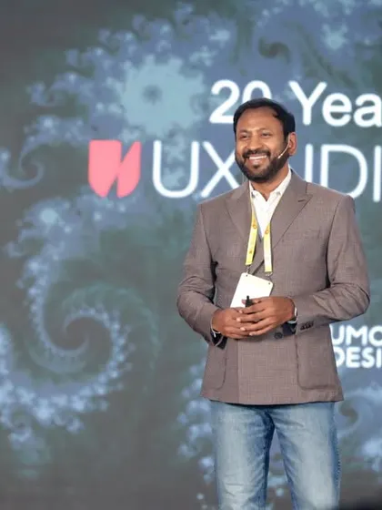 A confident speaker photographed on the UXINDIA stage. We aim to capture professional portraits of your key personnel and guests that can be used for a variety of corporate purposes.