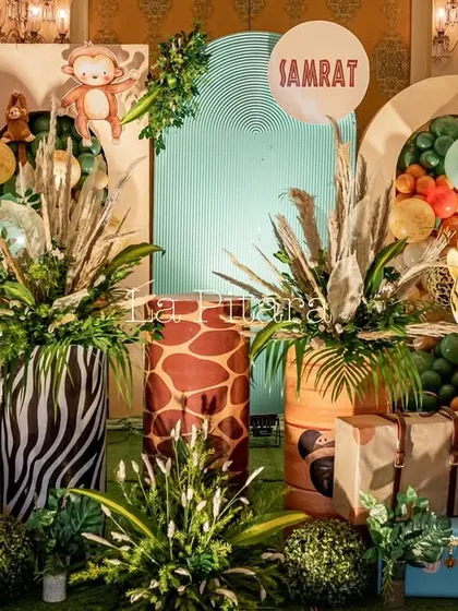 A detailed shot of the safari stage, showing the mix of animal print pedestals and vibrant green foliage.