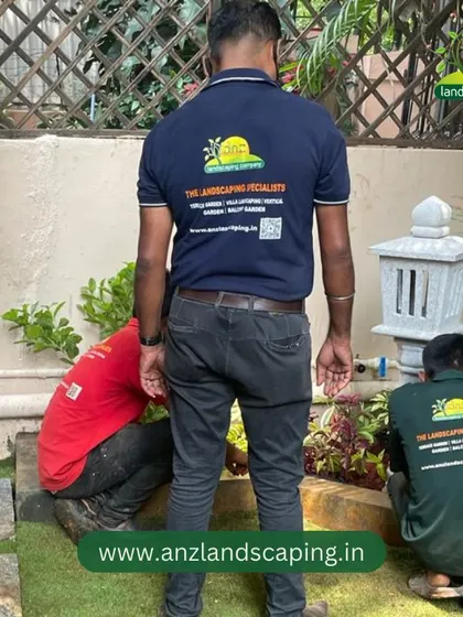 Another angle of our team at work, showing the collaborative effort involved in creating a beautiful garden.