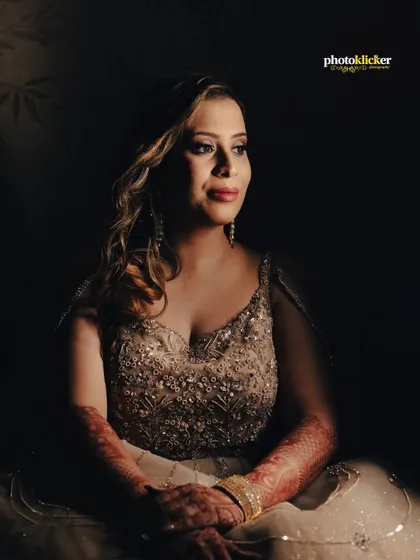 A beautifully lit portrait of the bride-to-be, using shadows to create a classic, painterly effect that highlights her features.
