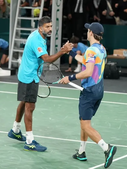 A handshake of partnership and trust. The bond between doubles partners is key to success.