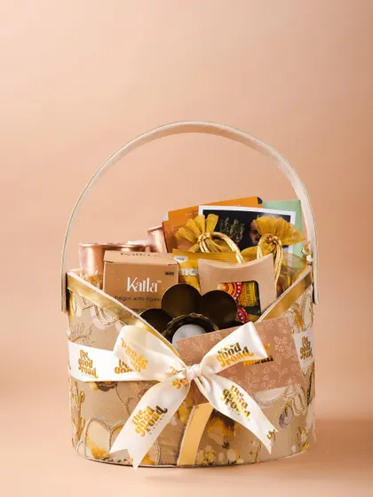 A beautifully crafted custom Diwali basket, tied with our signature ribbon. This hamper features copper tumblers and other unique items from homegrown Indian brands.