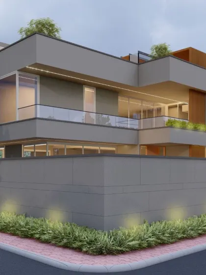 A corner view of a contemporary villa, showing how we layer materials and forms. The design uses cantilevered balconies and a mix of solid walls and glass to create a sense of depth and openness.