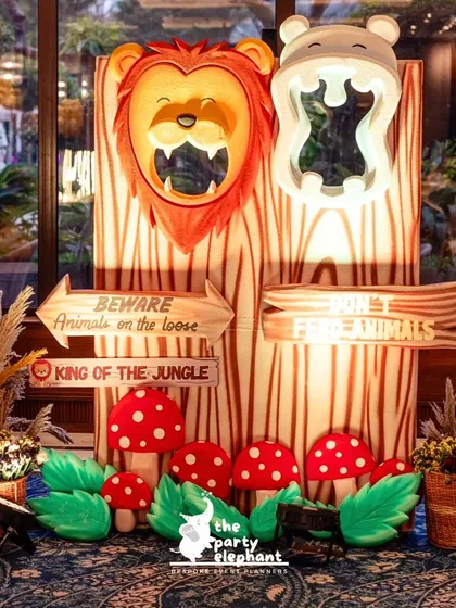 I designed this interactive photo prop where kids could peek through the mouths of a lion and a hippo. It was a huge hit at the safari party.