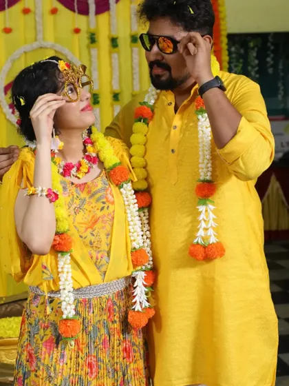 The happy couple sharing a playful moment during their Haldi ceremony. We focus on creating beautiful, candid moments that you'll cherish forever.
