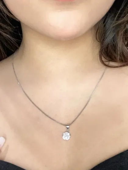 A detailed close-up of the GIVA pendant. This highlights the craftsmanship and sparkle of the jewelry, giving my audience a clear look at the product's quality.