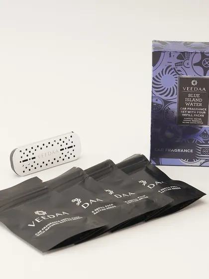 The complete car fragrance set, featuring our Blue Island Water scent. You get the stylish vent clip and four refill packs, each lasting for two weeks, for a total of eight weeks of luxurious fragrance.