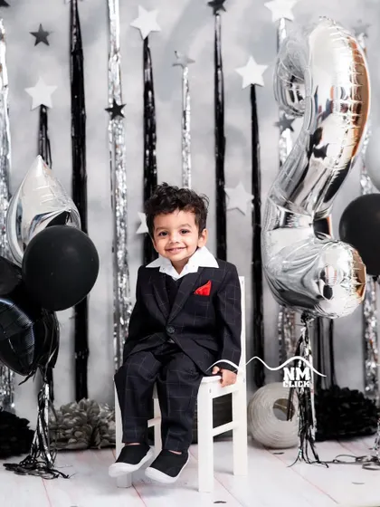 A handsome little gentleman celebrating his second birthday. We love the classic look of a suit for a milestone portrait.