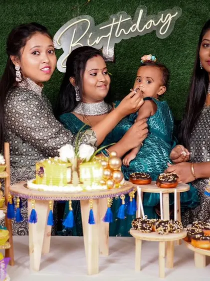 A charming 'Baby Boss' themed birthday party, with a sophisticated black and white color scheme, custom props, and a stylish backdrop, perfect for a little executive.