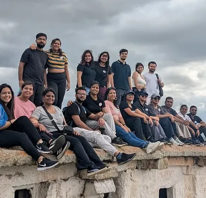 The group chilling on the ruins of an old fort during the Adiyogi day trip. It's a perfect mix of history and relaxation.