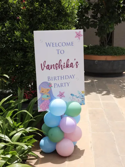 The welcome board for the mermaid-themed party.