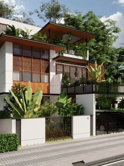 The Still House in Bengaluru is designed to settle into its landscape rather than compete with it. The architecture is defined by low horizontal lines, deep overhangs, and a restrained material palette that creates a quiet dialogue with the surrounding greenery.