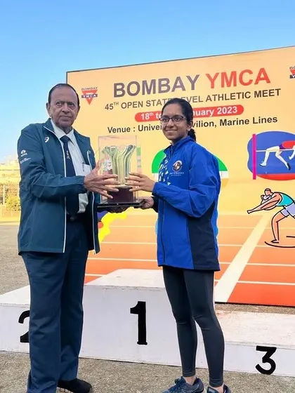 My athlete Eekisha Bhadsavale receiving her Individual Championship trophy at the YMCA Open State Level meet.