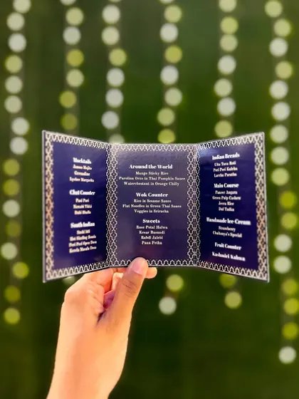 Another beautiful, custom-designed tri-fold menu, detailing the extensive offerings from mocktails and chaat to handmade ice cream and sweets.