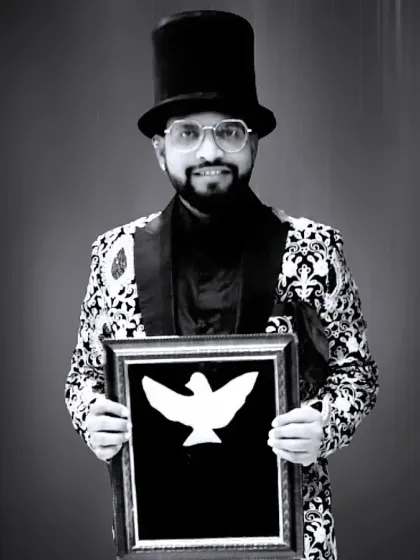 A classic magician's portrait with a dove illusion frame. This image captures the mystery and artistry of my craft.