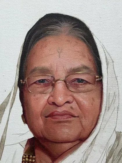 A work in progress shot of the same commissioned oil portrait. Building up the layers in oil paint allows for incredible depth and realism, especially in capturing the skin tones and textures.
