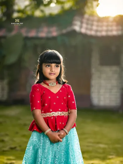A beautiful portrait of a young girl in traditional attire, with the soft evening light creating a magical glow in our garden.