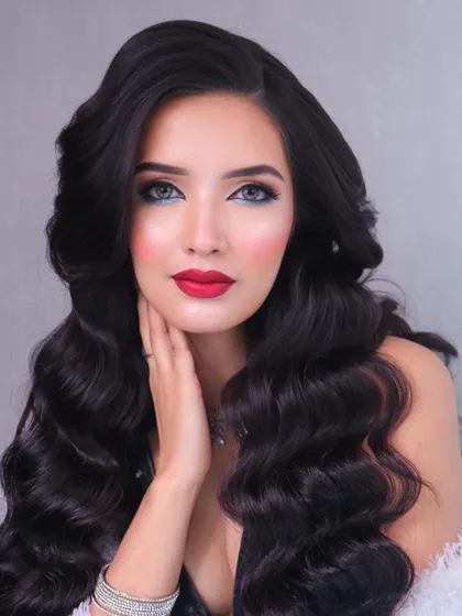 A close-up on the flawless red lip and perfectly executed winged liner, key components of this classic glam look.