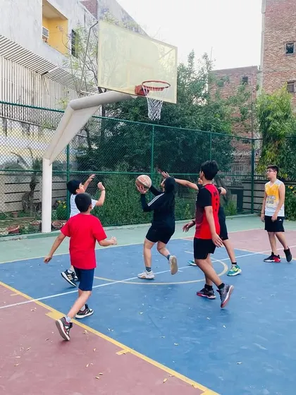 Action under the hoop with our junior players learning to rebound and score.