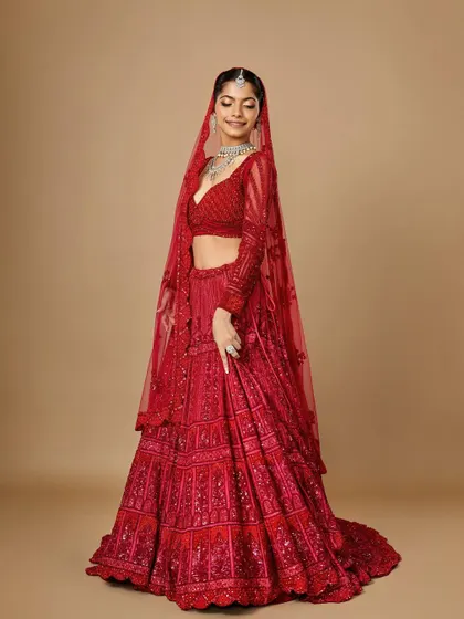 A full-length shot of the classic red bride, showing how the makeup and hair complete the entire vision. My students learn to think about the entire picture, not just the face.