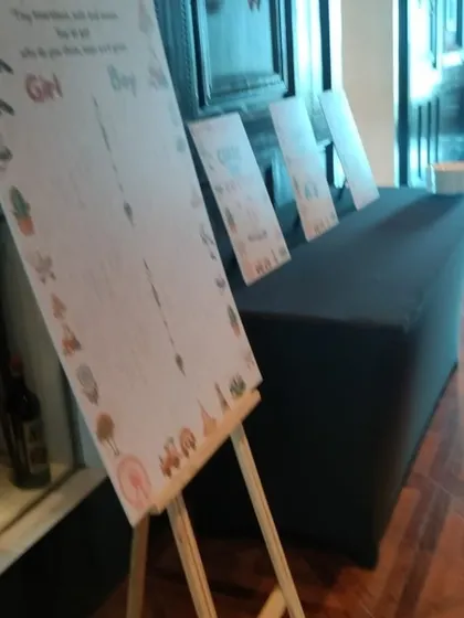 We also provide fun, interactive elements for your baby shower, like these game boards where guests can guess the baby's gender or leave well wishes for the parents-to-be.