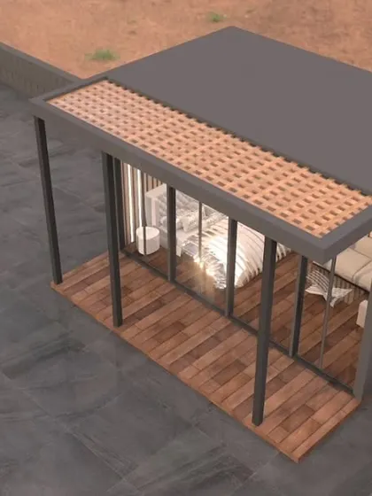 An isometric 3D model of the glass house porta-cabin. This view shows the overall structure, including the covered porch area and the main enclosed room.