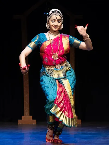 A moment from the 'Kanasu' festival, where I performed a piece celebrating the joy of dance. The vibrant costume and expressive mudra convey a feeling of blissful offering.