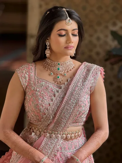 An eyes-closed portrait to highlight the soft, blended eyeshadow and the flawless finish of her makeup.