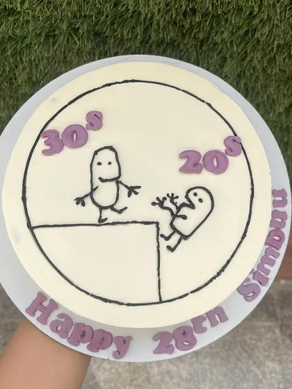 This hand-held shot shows the clean lines and fun character of our doodle cakes, perfect for sharing on social media.