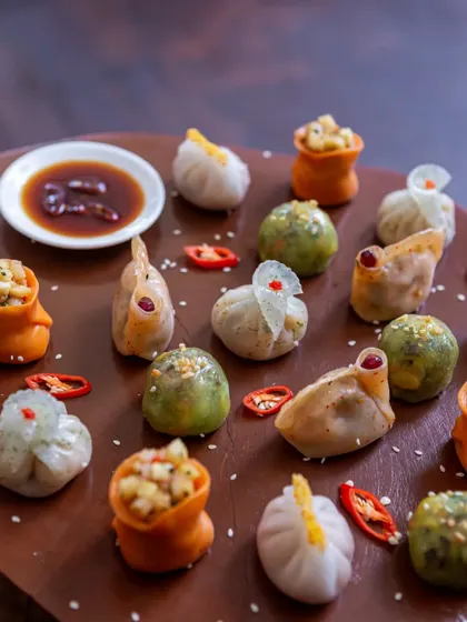 A colourful assortment of handcrafted dim sum, showcasing a variety of shapes and fillings.