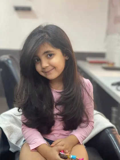This sweet client is all smiles after her new haircut. I gave her long, flowing layers that add shape to her hair without sacrificing length.