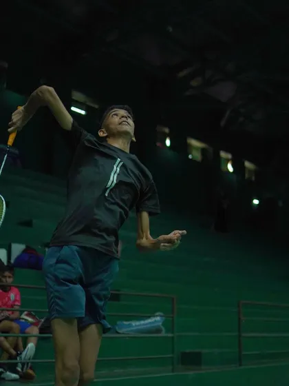 An action shot of a player executing a powerful jump smash. We capture these moments of peak performance to inspire all our athletes.