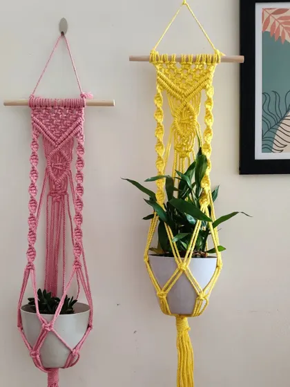 The pink and yellow hangers look so cheerful together.