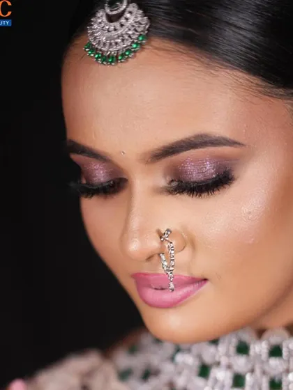 Another angle of the purple eyeshadow look, showing the expert blending and lash work.